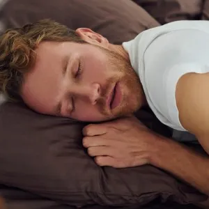 Man snoring while sleeping